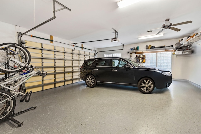 garage featuring ceiling fan and a garage door opener