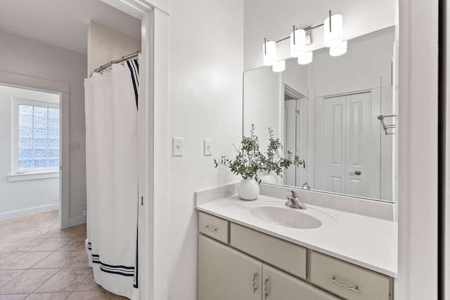 bathroom with tile patterned flooring and vanity