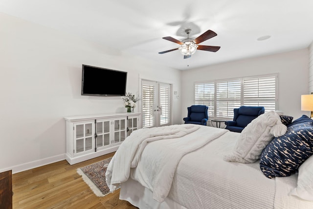 bedroom with light hardwood / wood-style floors and ceiling fan