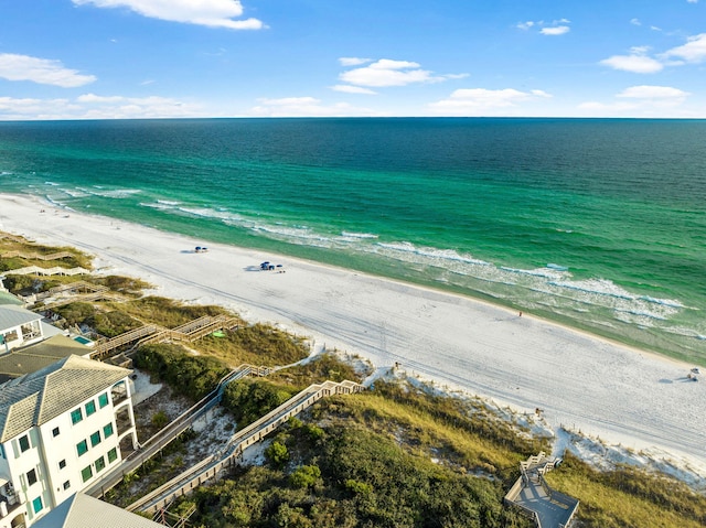 birds eye view of property featuring a view of the beach and a water view