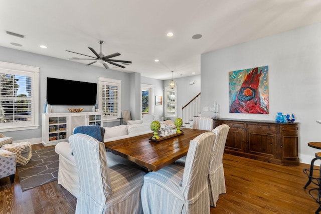 dining area featuring ceiling fan and dark hardwood / wood-style floors