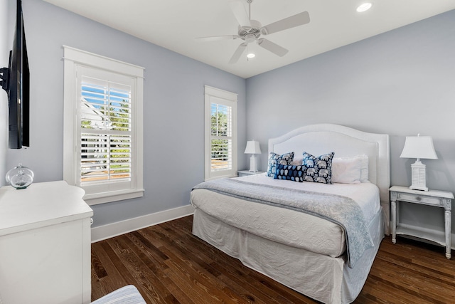 bedroom featuring dark hardwood / wood-style flooring and ceiling fan