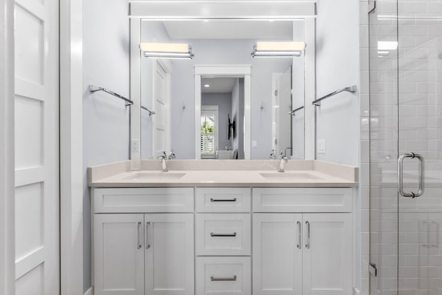 bathroom with vanity and an enclosed shower