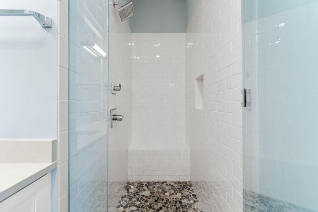 bathroom with a shower with door