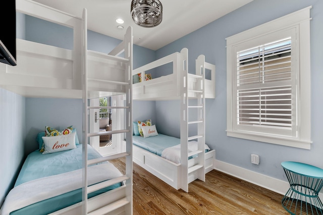 bedroom with hardwood / wood-style floors