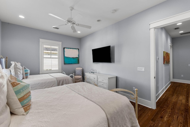 bedroom with ceiling fan and dark hardwood / wood-style floors