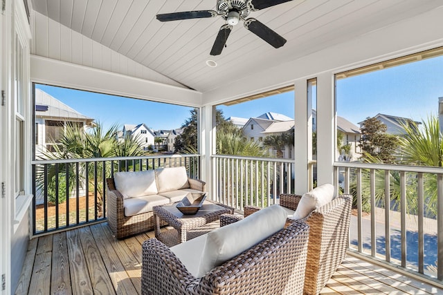 sunroom with wooden ceiling, plenty of natural light, lofted ceiling, and ceiling fan