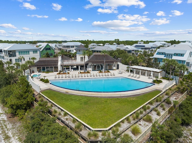 view of pool with a yard and a patio