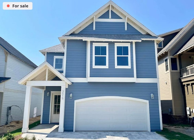 craftsman house with a garage