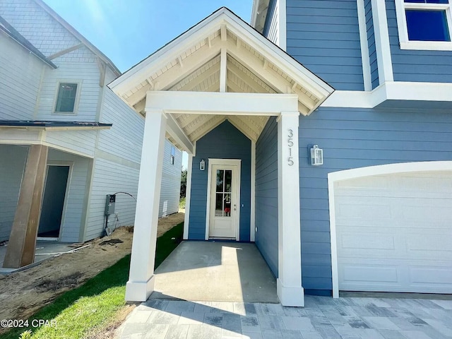 entrance to property featuring a garage