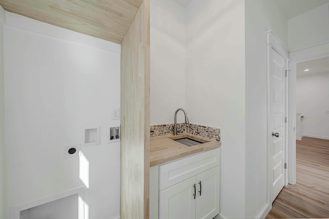 bathroom featuring hardwood / wood-style flooring and sink