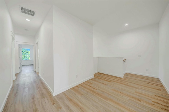 spare room with light wood-type flooring