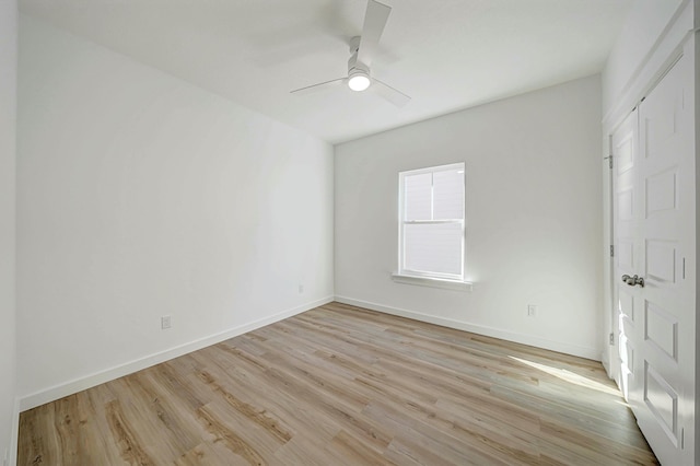 spare room featuring ceiling fan and light hardwood / wood-style floors