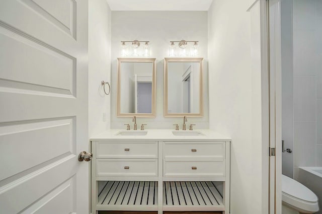 bathroom featuring vanity and toilet