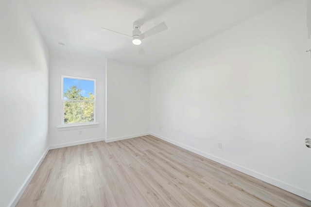 unfurnished room featuring ceiling fan and light wood-type flooring