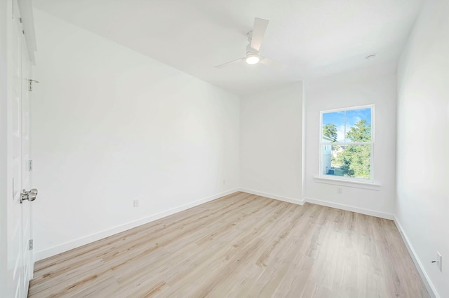 unfurnished room with ceiling fan and light wood-type flooring