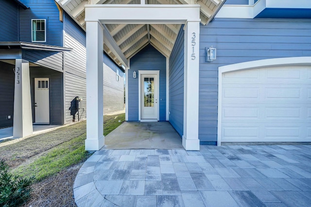 doorway to property featuring a garage