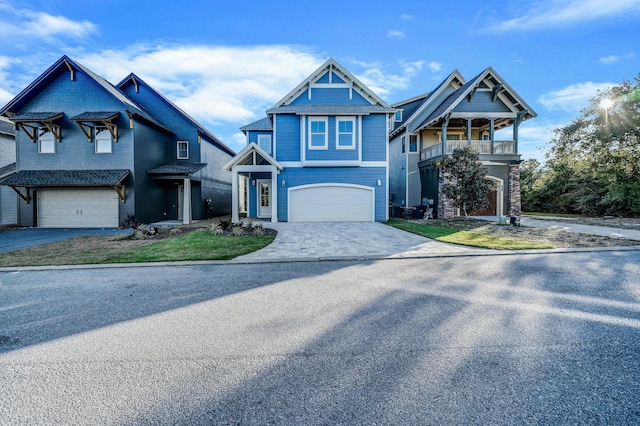 view of front of house featuring a balcony and a garage