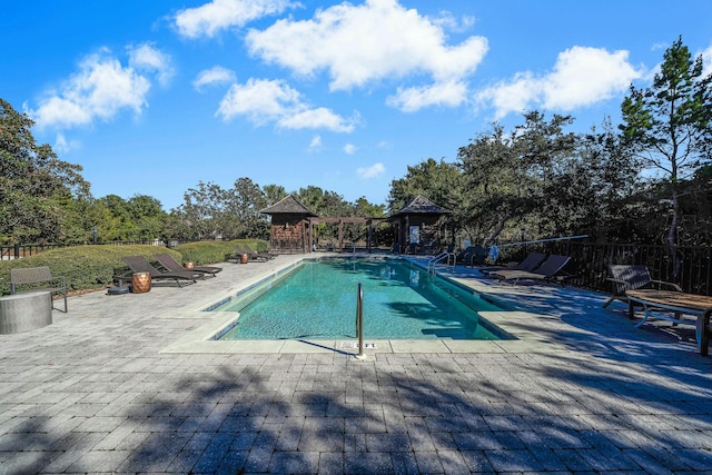 view of pool featuring a gazebo and a patio area