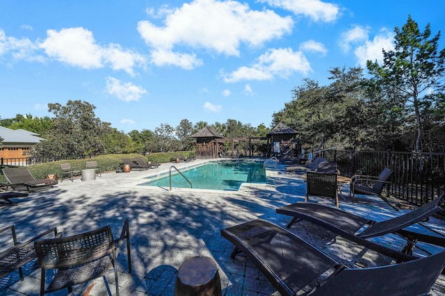 view of swimming pool featuring a gazebo and a patio area