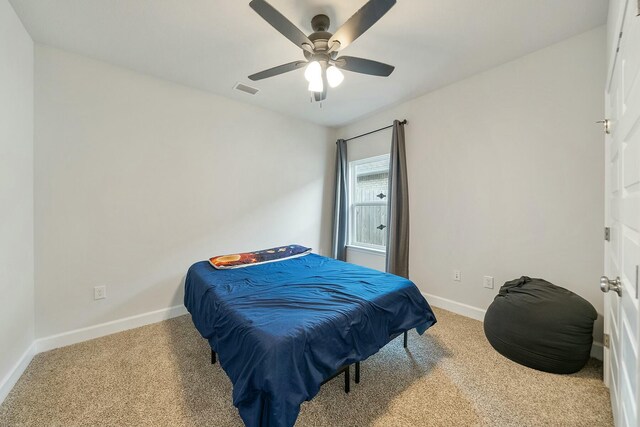 bedroom with light colored carpet and ceiling fan