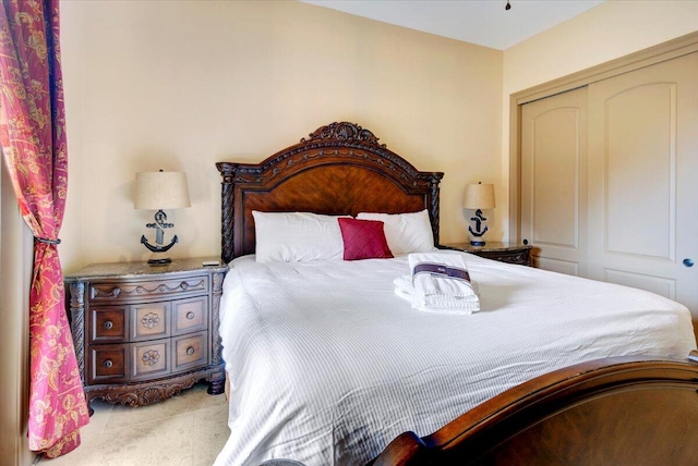 bedroom featuring a closet and light colored carpet