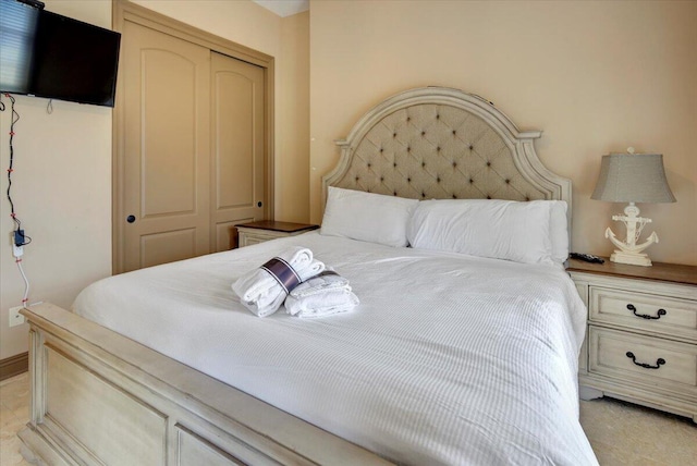 carpeted bedroom with a closet