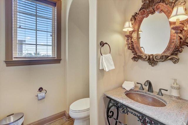 bathroom featuring toilet and sink