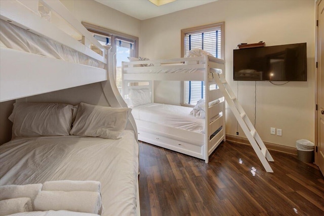 bedroom featuring dark hardwood / wood-style flooring