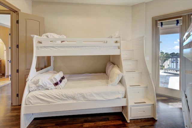 bedroom featuring dark hardwood / wood-style floors and access to exterior