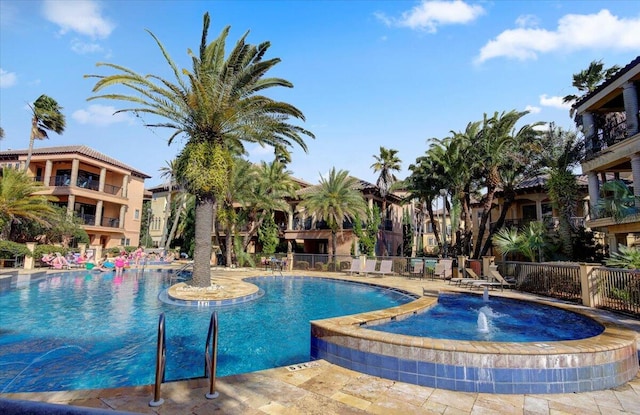 view of swimming pool featuring pool water feature