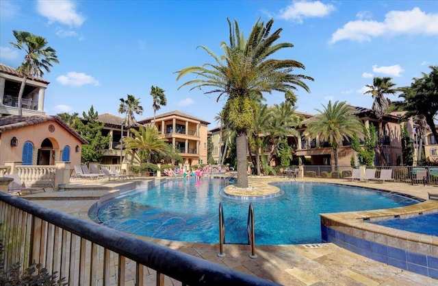 view of swimming pool with a patio