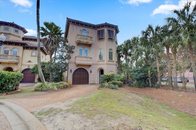 mediterranean / spanish-style home featuring a garage