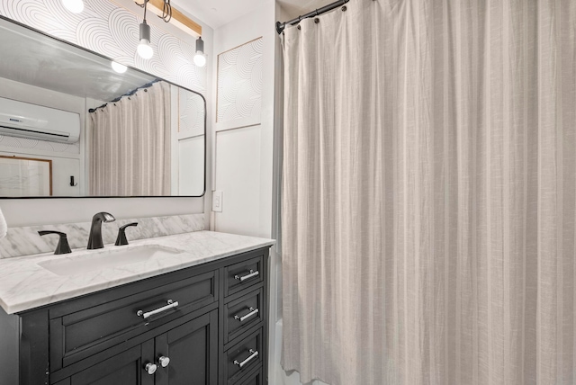 bathroom with vanity, a wall mounted AC, and curtained shower