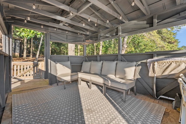 view of patio featuring a wooden deck and an outdoor living space