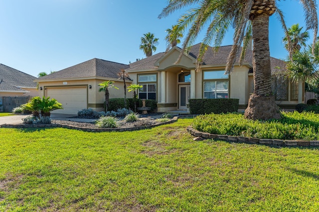 view of front facade featuring a front yard and a garage