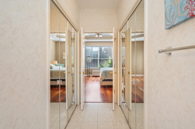 hall with light hardwood / wood-style flooring