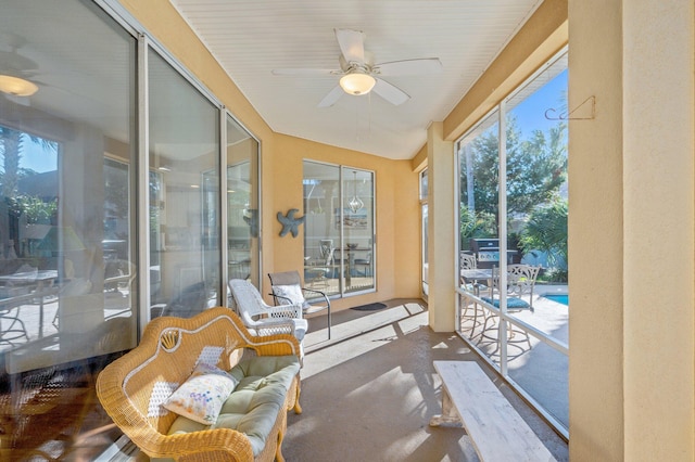 sunroom / solarium with ceiling fan and a healthy amount of sunlight