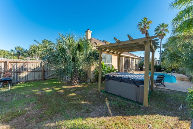 view of yard with a pergola and a pool with hot tub