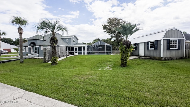 view of yard with an outdoor structure and a sunroom