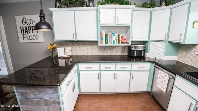 kitchen with pendant lighting, dishwasher, white cabinets, and dark stone countertops