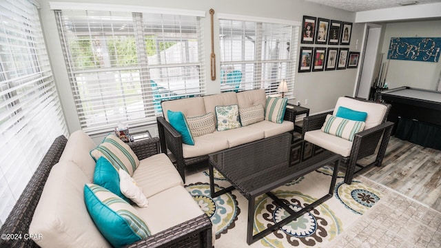 living room featuring hardwood / wood-style floors and billiards