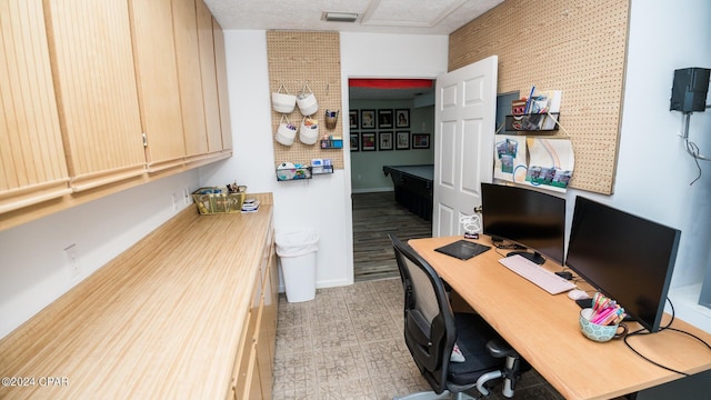 office space featuring a textured ceiling, light hardwood / wood-style floors, and pool table