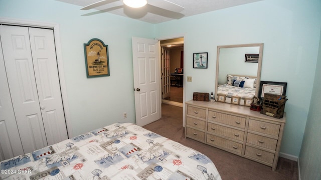 carpeted bedroom with a closet and ceiling fan