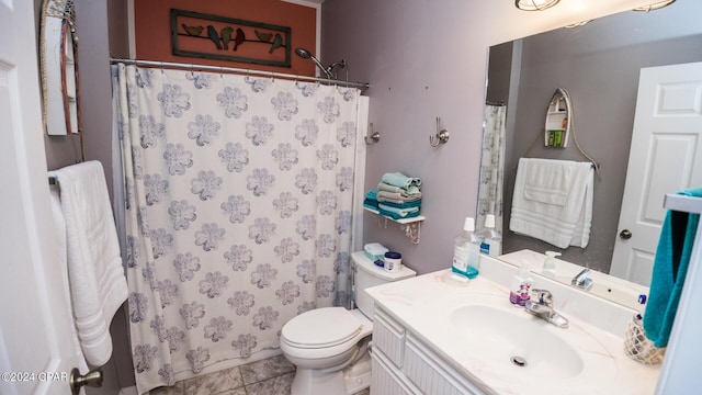 bathroom with tile patterned floors, vanity, toilet, and a shower with shower curtain