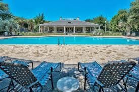 community pool featuring a patio area