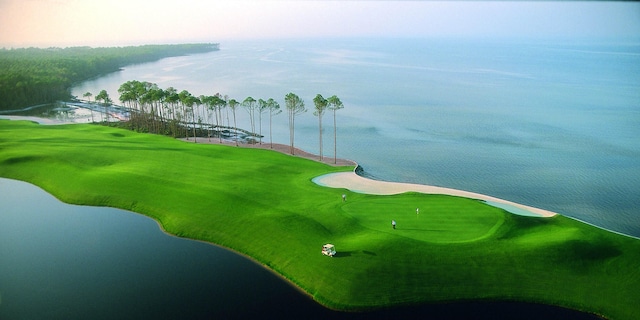 view of community featuring view of golf course and a water view