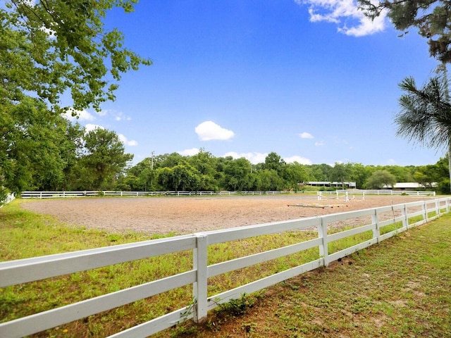 view of yard featuring a rural view and an enclosed area