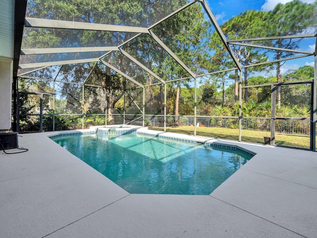 view of pool with a pool with connected hot tub, a lanai, and a patio