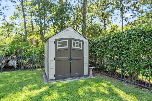 view of shed with fence